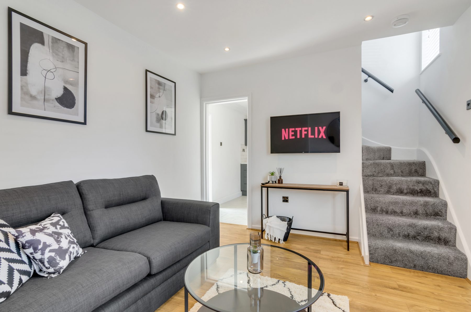 Living room at Horning Close, with sofa and TV